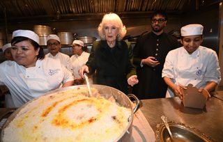 King Charles III and Queen Camilla meet British Muslim women at a female led restaurant and help pack donation boxes ahead of Ramadan, at Darjeeling Express, Kingly Court, Carnaby Street on February 26, 2025 in London, England