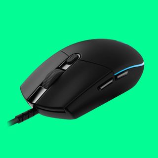 An image of a Logitech G Pro wired gaming mouse against a pale green background