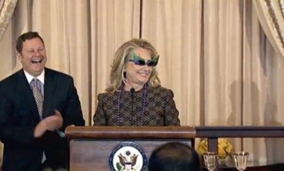 Secretary of State and internet meme star Hillary Clinton, attempted to spice up the swearing in of Assistant Secretary for Public Affairs Michael Hammer by sporting some funky accessories.