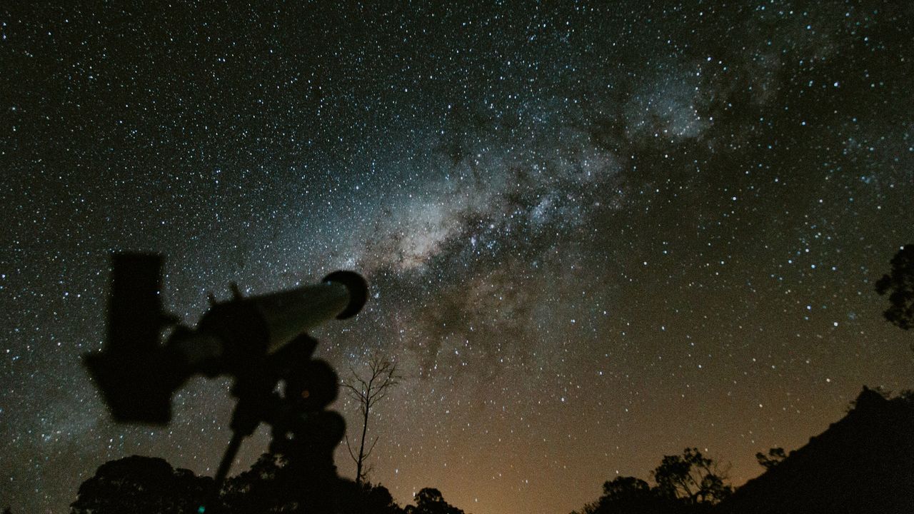 telescope with night sky in the background