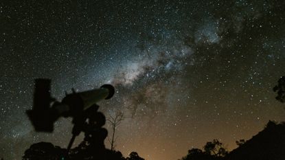 telescope with night sky in the background