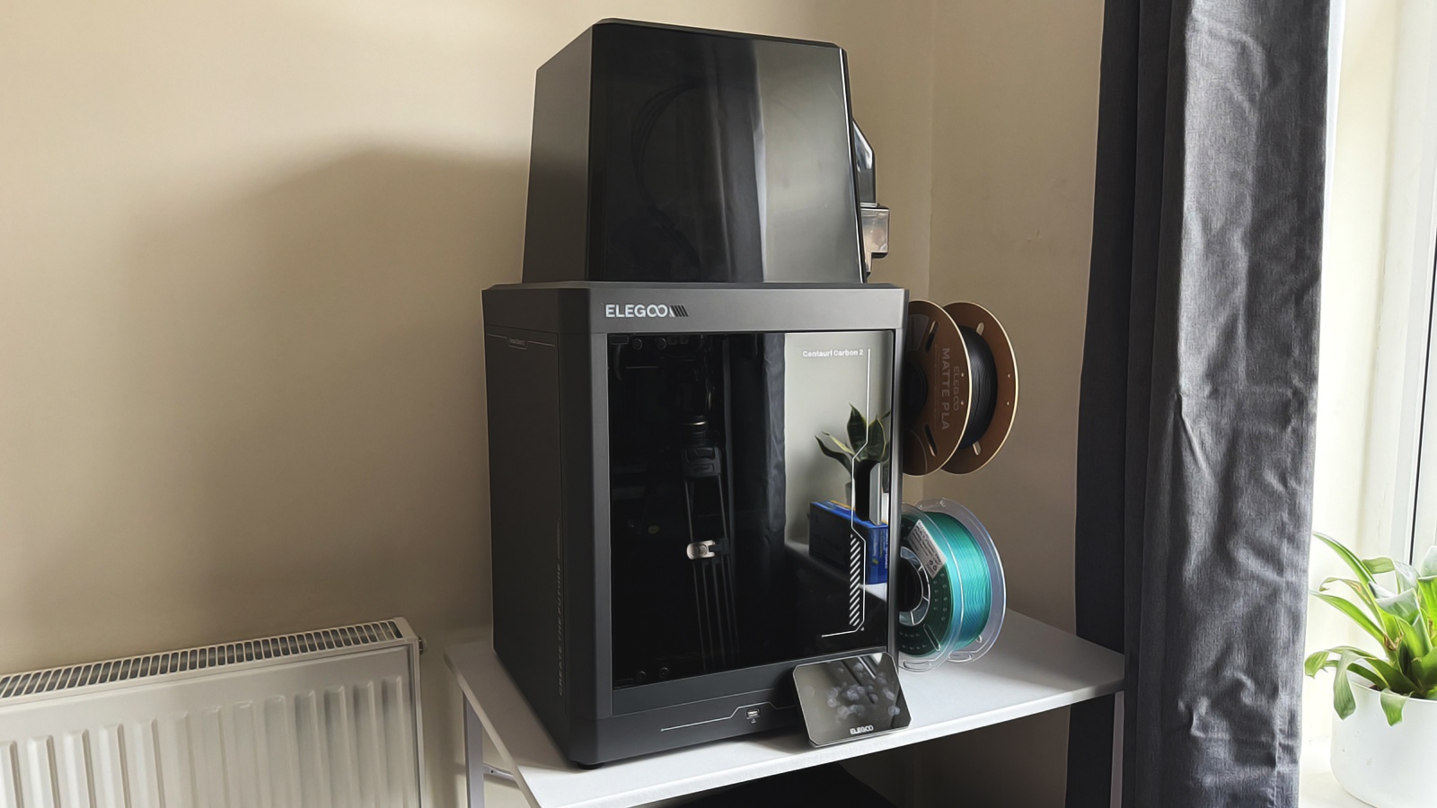 An Elegoo Centauri Carbon 2 on a desk.