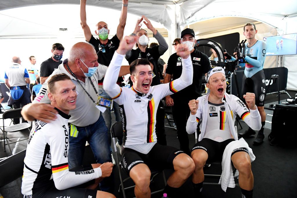 BRUGES BELGIUM SEPTEMBER 22 LR Tony Martin of Germany Max Walscheid of Germany and Nikias Arndt of Germany celebrates winning during the 94th UCI Road World Championships 2021 Team Time Trial Mixed Relay a 445km race from KnokkeHeist to Bruges flanders2021 TT on September 22 2021 in Bruges Belgium Photo by Simon Wilkinson PoolGetty Images