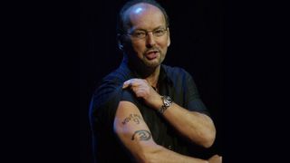 Peter Moore displaying his famous Halo 2 release date tattoo in 2004.
