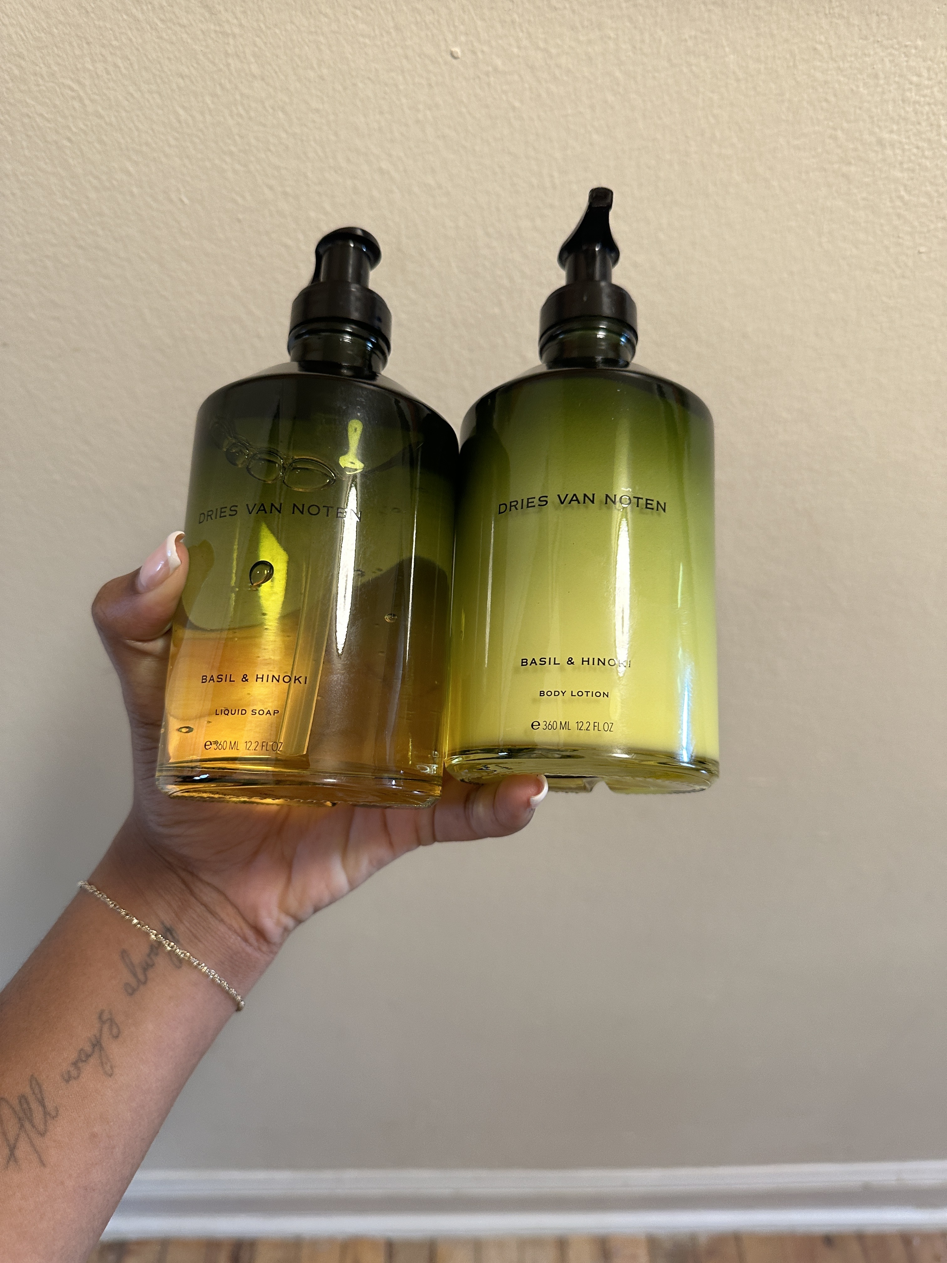 ariel baker holding the Basil and Hinoki body collection