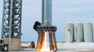 SpaceX's Booster 7 Super Heavy prototype fires one of its Raptor engines for 20 seconds during a test on Aug. 11, 2022.
