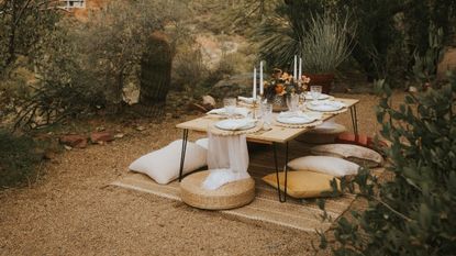 The best summer candles laid out on an outdoor table setting