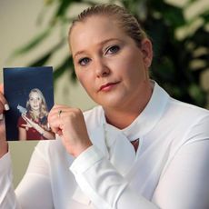 Virginia Roberts Giuffre, with a photo of herself as a teen, when she says she was abused by Jeffrey Epstein, Ghislaine Maxwell and Prince Andrew, among others.