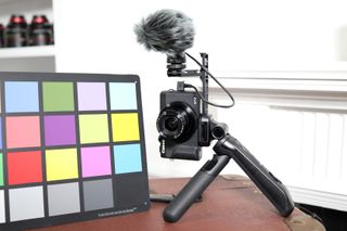 The Canon HG-100TBR can shoot in vertical orientation while keeping the Canon DM-E100 upright