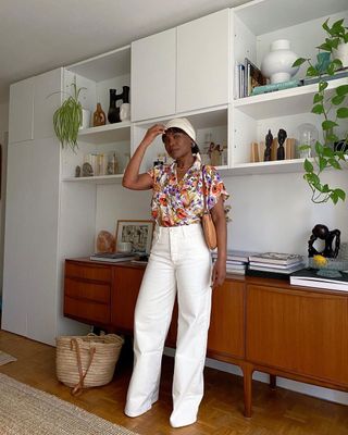@frannfyne wearing wide-leg white trousers with a floral shirt
