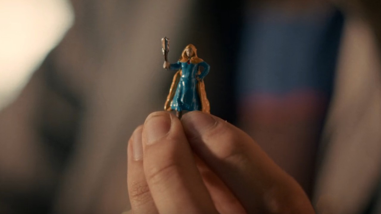 Mike&#039;s Holly the Heroic figurine. She has a yellow cape and blue dress.