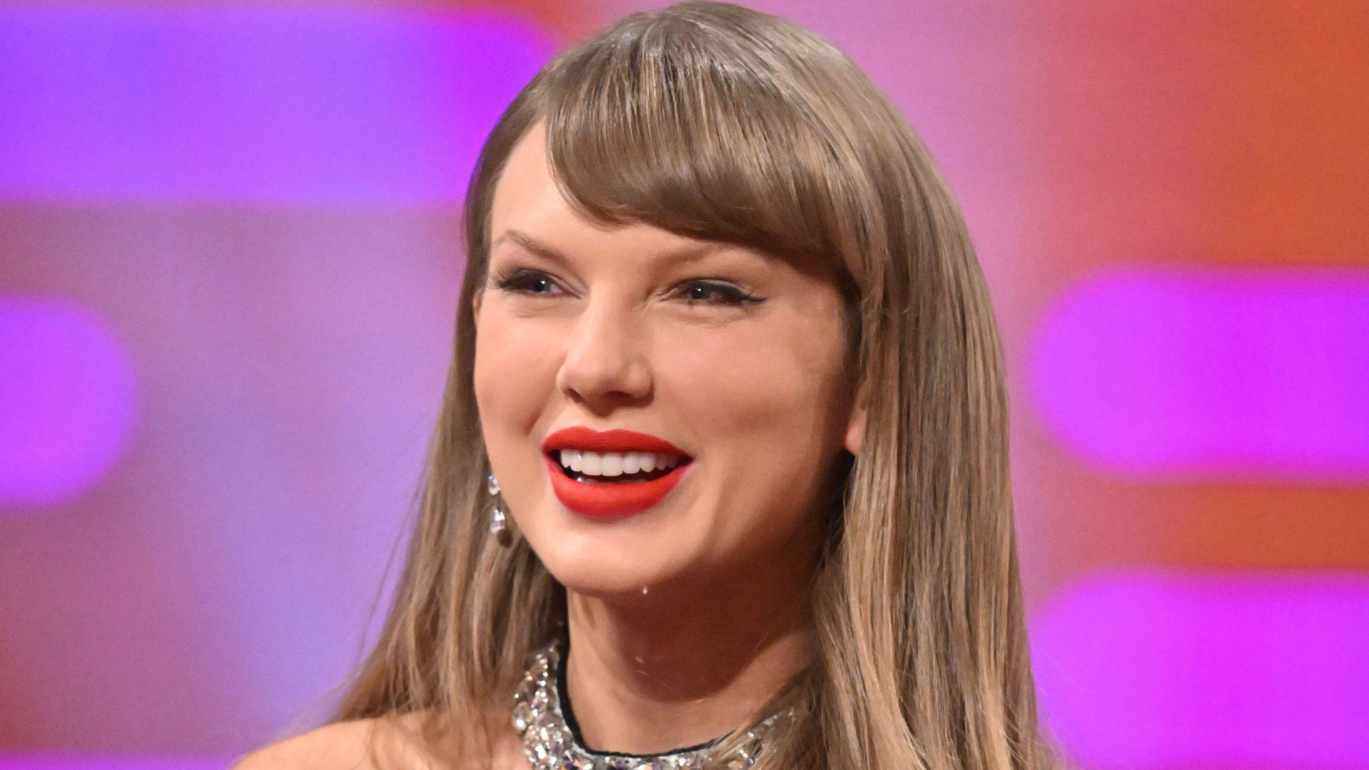 Taylor Swift wearing a collared David Koma dress on a talk show