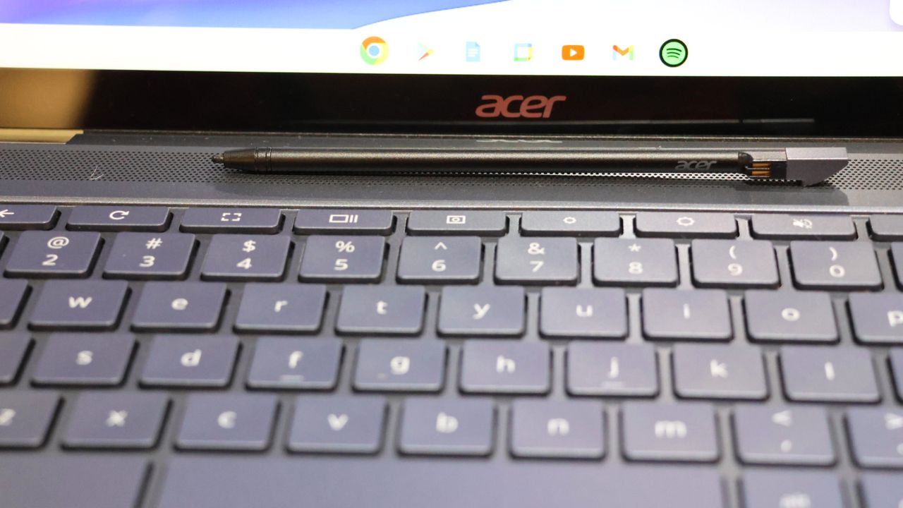 Close-up of a stylus resting on the Acer Chromebook Spin 714's keyboard.