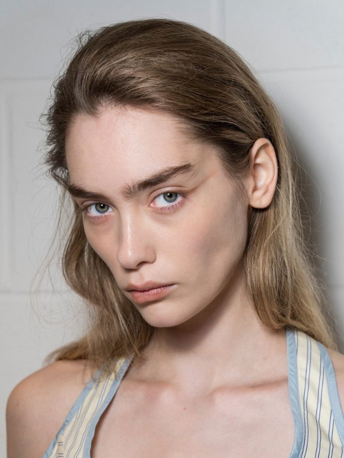 A close-up of a model backstage at the Mithridate S/S 27 show