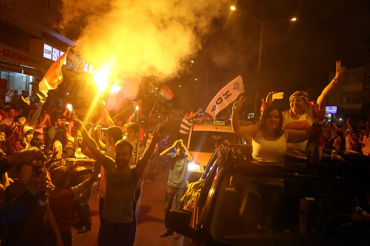 Supporters of Turkey&amp;#039;s Kurdish People&amp;#039;s Democratic Party celebrate their gains in Sunday&amp;#039;s election