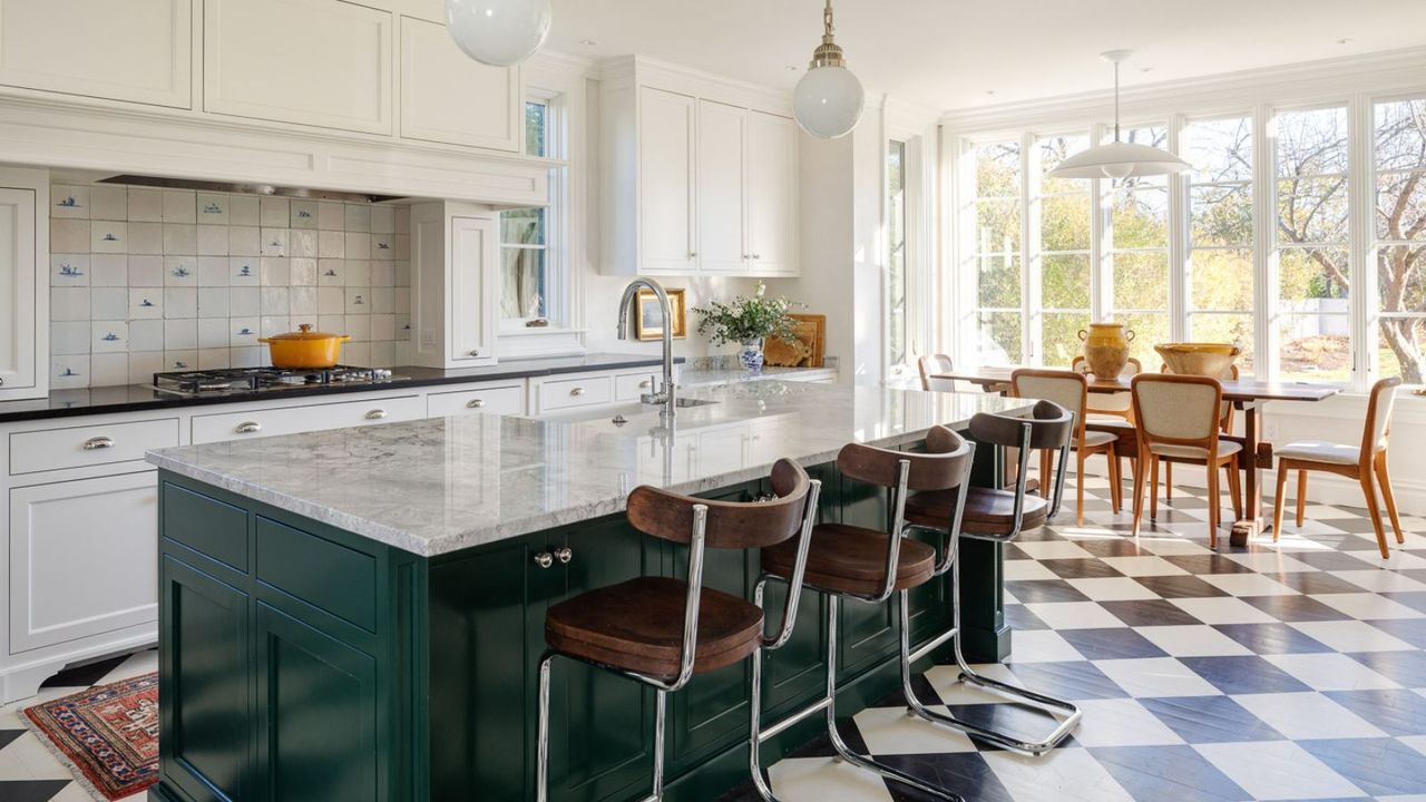 A green and white kitchen with checkered flooring 