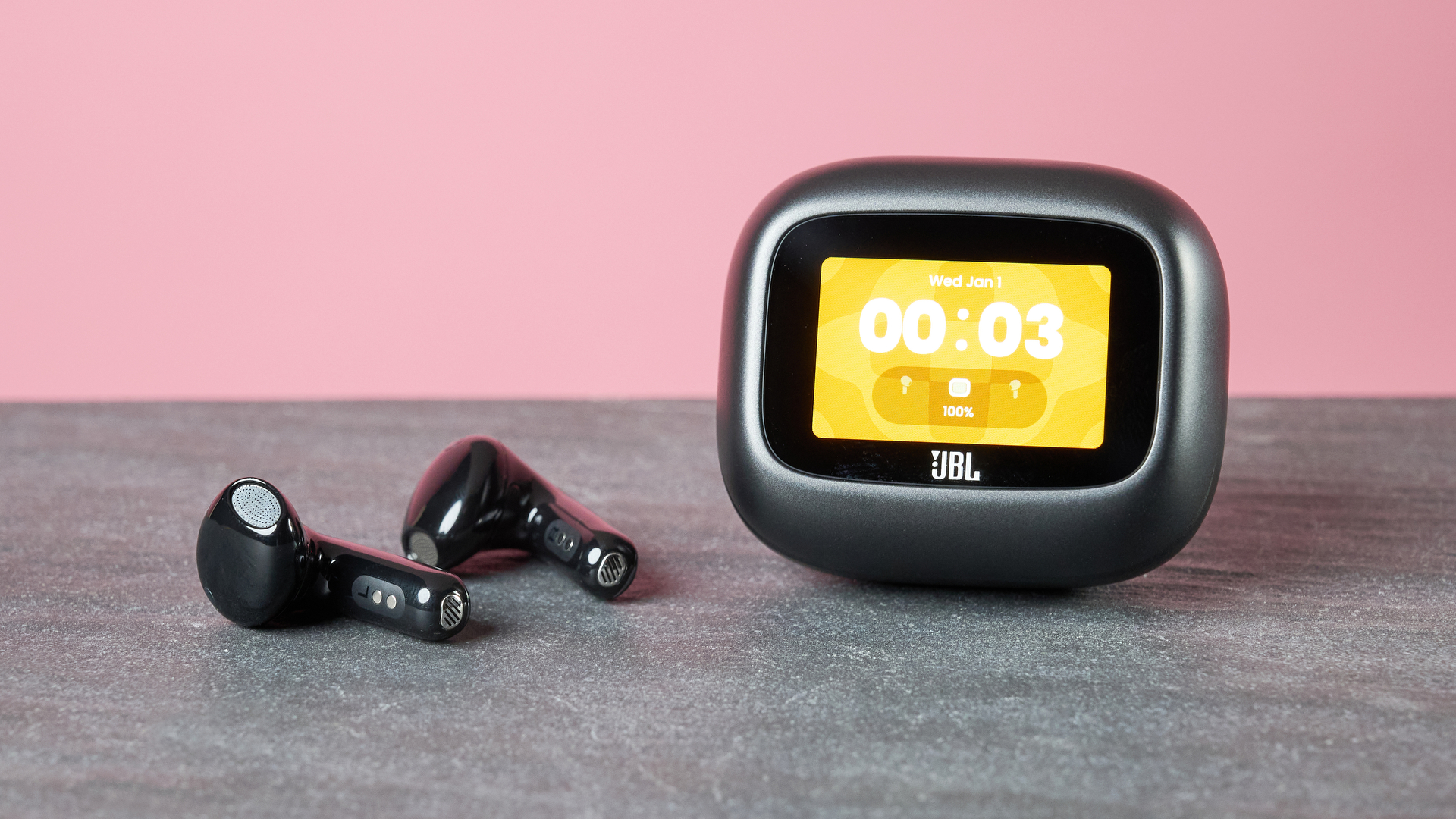 JBL Live Flex 4 on table with display on