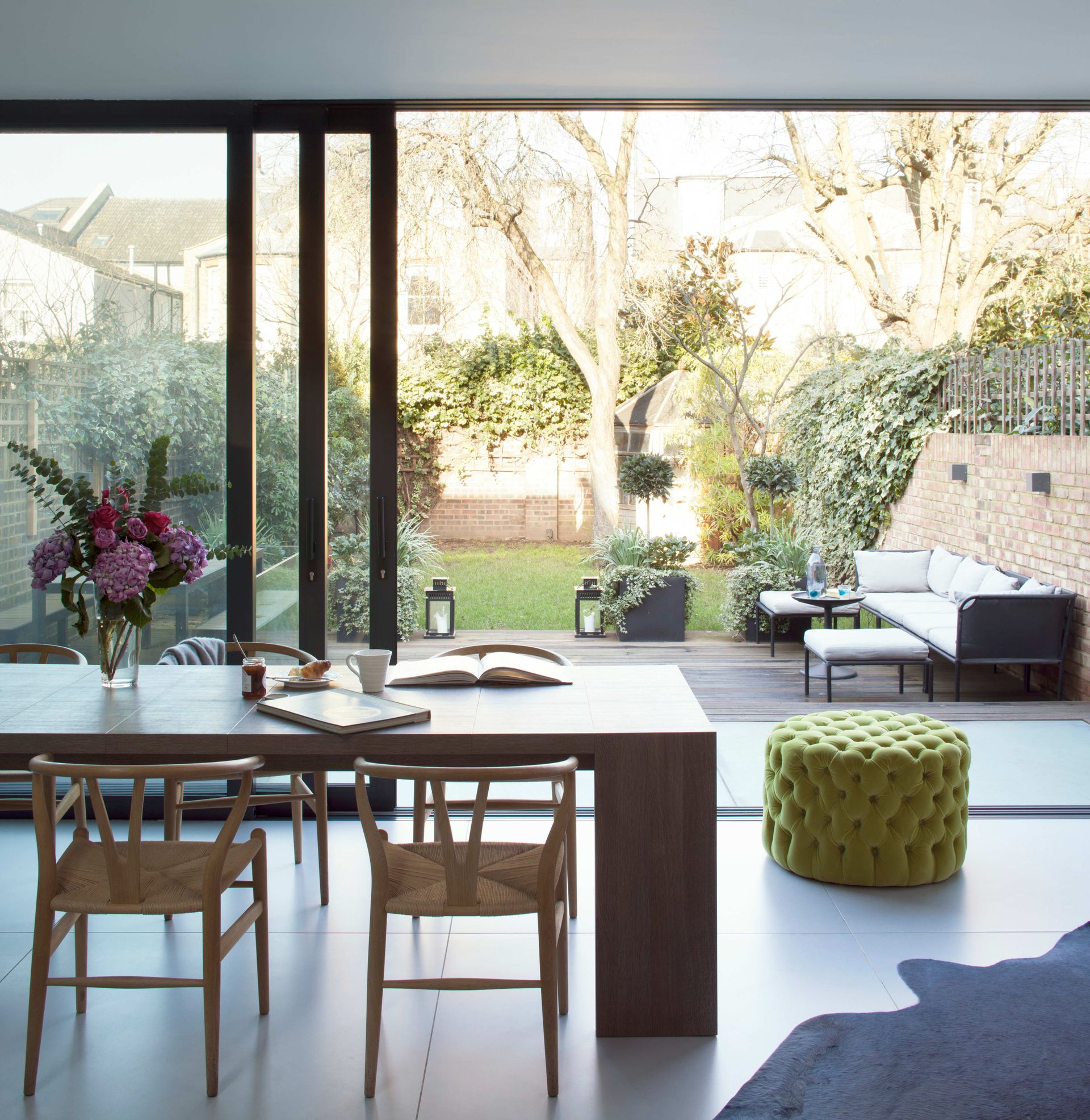 Open plan dining room with sliding doors onto garden
