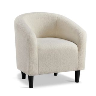 A white boucle armchair with black legs