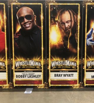Bobby Lashley and Bray Wyatt in posters next to each other at The WWE Superstore.