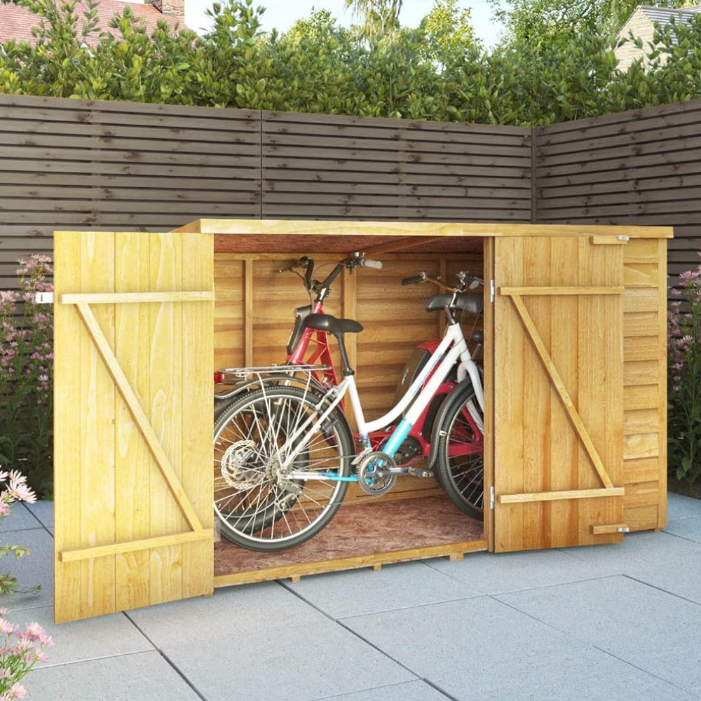 Bike inside of a wooden bike shed with double doors