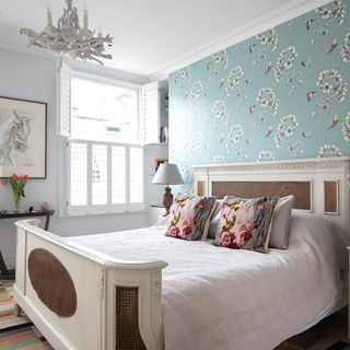 bedroom with birdie cushions and amazilia wallpaper