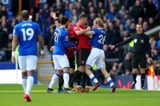 Everton’s Tom Davies, right, and Manchester United’s Nemanja Matic grapple during the two teams' Premier League draw in March 2020