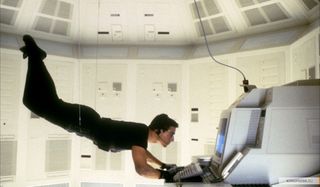 Tom Cruise hanging from the ceiling, while accessing a computer in Mission: impossible