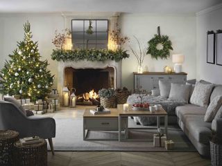white living room with sofa and christmas tree
