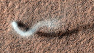 A dust devil on Mars seen by the Mars Reconnaissance Orbiter in 2012.