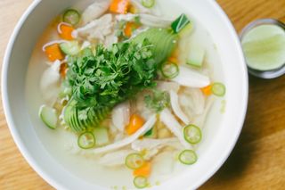 New York restaurants: wholesome chicken soup with tortillas and lime