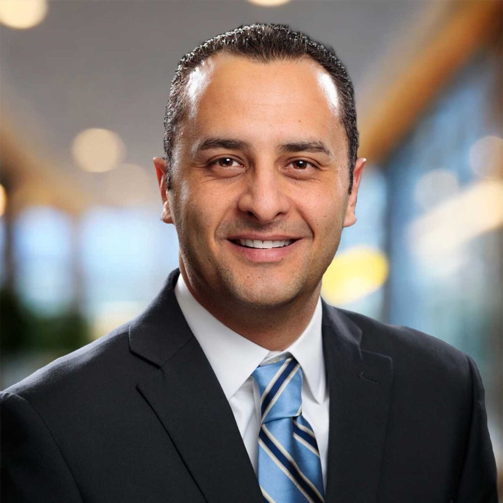 A headshot of Juan C. Rezk