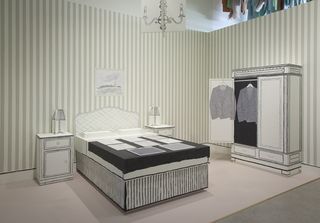 A replica of the Paris hotel room where he sold his first collection in 1976