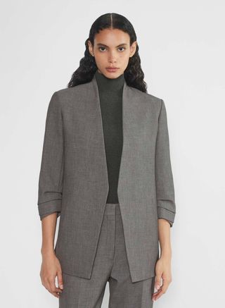 Aritzia model wearing grey blazer and grey pants