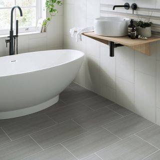 bathroom with white tiled walls