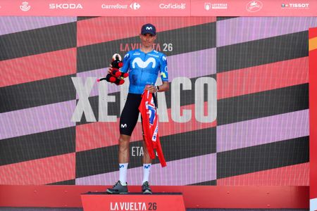 XERACO, SPAIN - AUGUST 29: Enric Mas of Spain and Movistar Team celebrates at podium as Red Leader Jersey winner without putting on a jersey as a sign of respect for the injured former leader Tadej Pogacar of Slovenia and UAE Team Emirates XRG, during the La Vuelta - 81st Tour of Spain 2026, Stage 8 a 171km stage from Pucol to Xeraco / #UCIWT / on August 29, 2026 in Xeraco, Spain. (Photo by Alexander Hassenstein/Getty Images)
