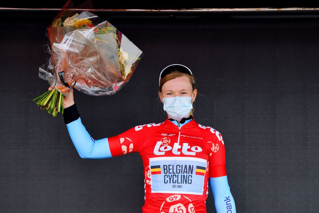 BRUGGE BELGIUM JUNE 23 Jolien Dhoore of Belgium and Belgium National Team Red Leader Jersey celebrates at podium during the 9th Lotto Belgium Tour 2021 Stage 1 a 1126km stage from Blankenberge to Bruges LottoBelgTour LottoBelgiumTour on June 23 2021 in Brugge Belgium Photo by Luc ClaessenGetty Images