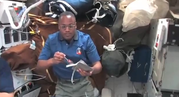 NASA astronaut Alvin Drew wearing Superfocus glasses on day four of space shuttle Discovery&#039;s STS-133 mission to the International Space Station