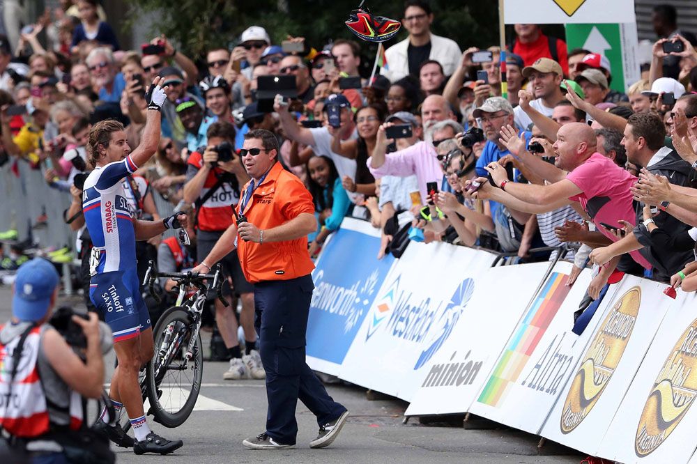 Peter Sagan (Slovakia) throws his race helmet to the fans after his win