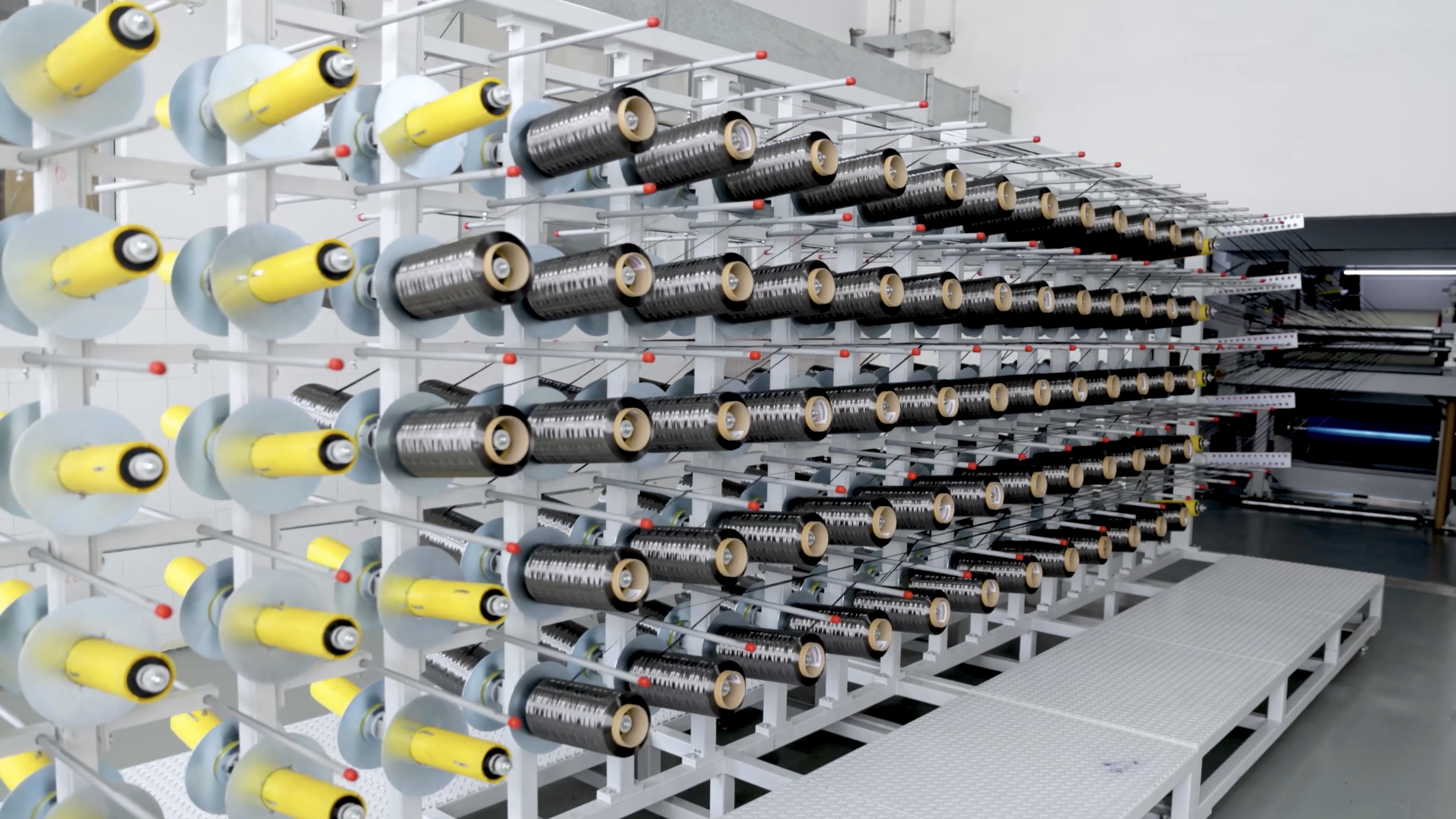 XDS Factory, raw carbon frame being assembled by workers