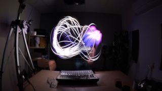 Light trails being painted in a dark room, shot on the GoPro Hero13 Black