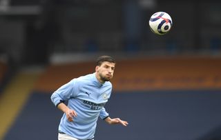 Manchester City’s Ruben Dias warming up prior to kick-off during the Premier League match at the Etihad Stadium, Manchester. Picture date: Sunday March 7, 2021