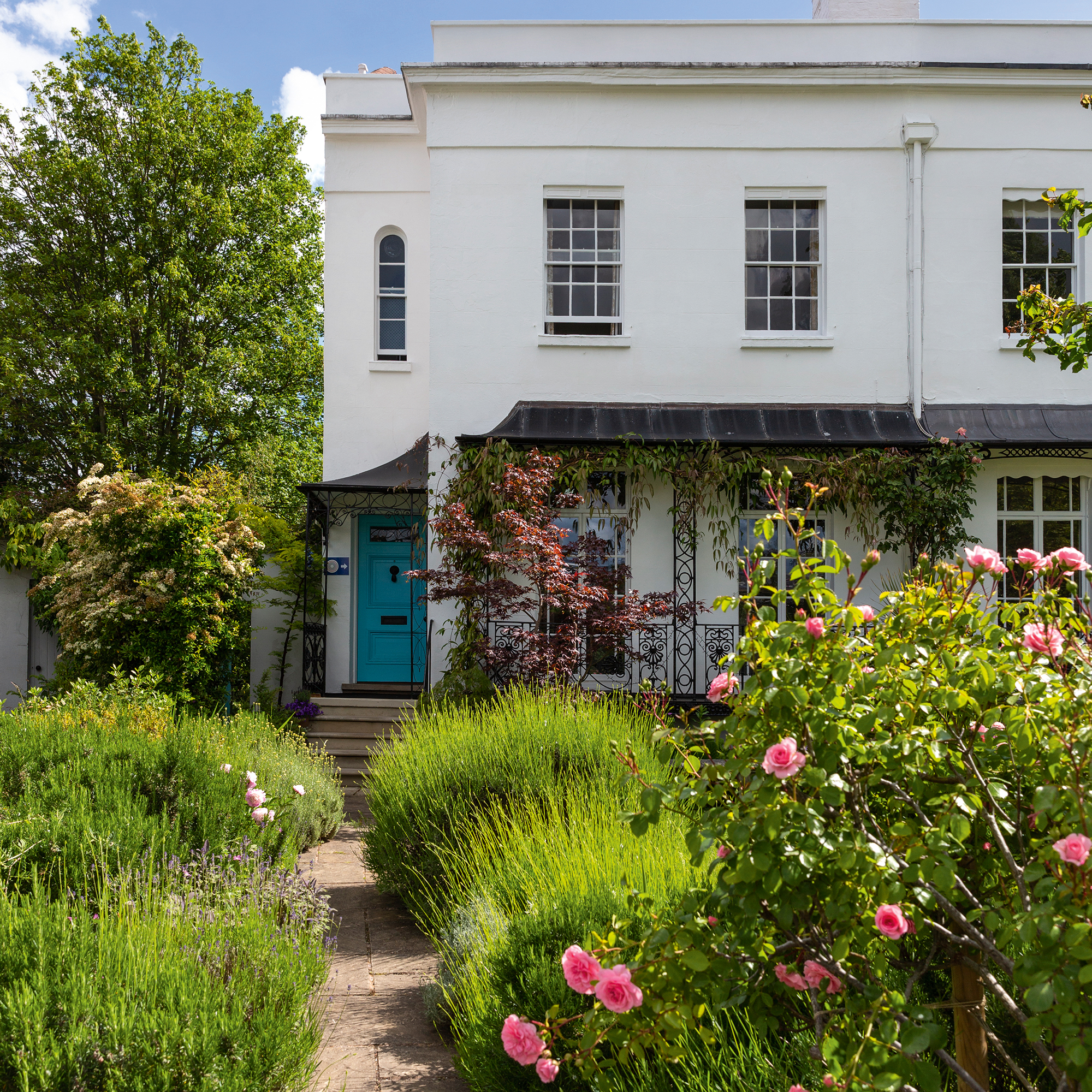 Herbaceous border leading up to end of terrace house