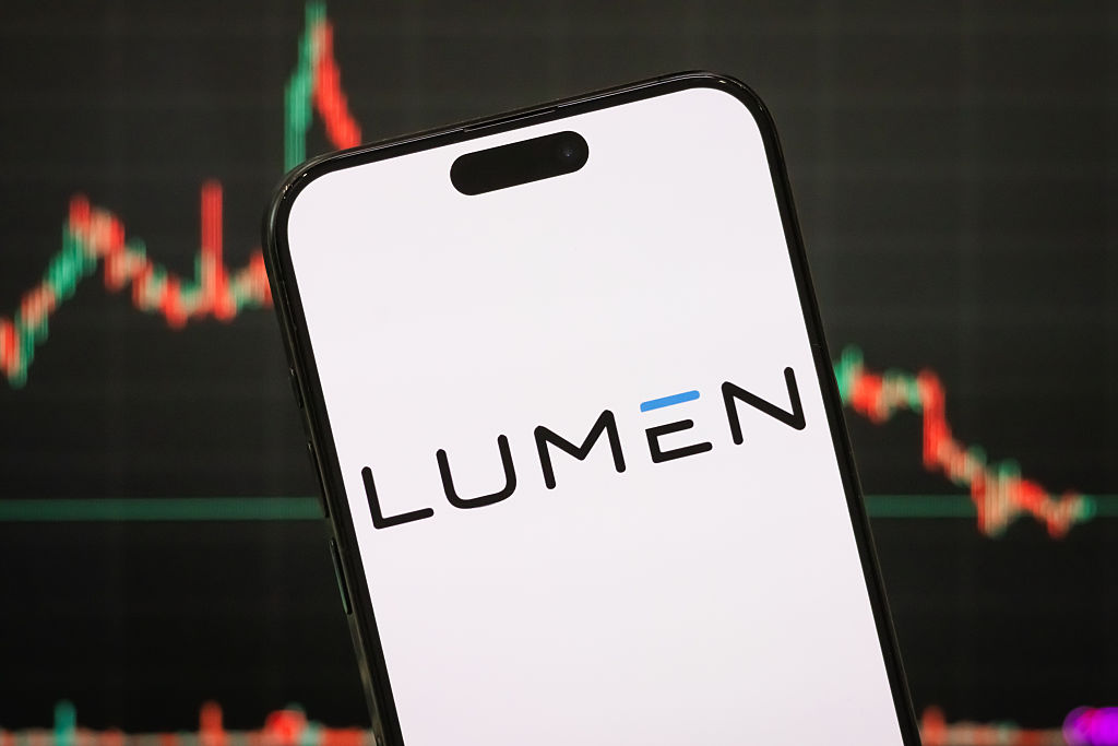 Lumen Technologies logo on a smartphone with a blurred stock chart in the background