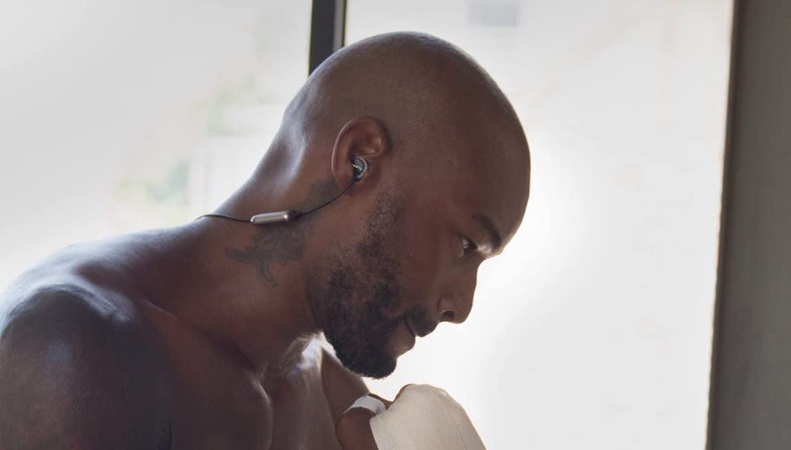 Model Tyson Beckford exercising with the Sol Republic Relays Sport Wireless