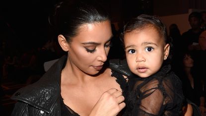 paris, france september 28 l r kim kardashian and baby north west attend the givenchy show as part of the paris fashion week womenswear springsummer 2015 on september 28, 2014 in paris, france photo by pascal le segretaingetty images