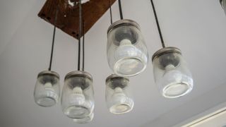 A unique light fixture made using old mason jars