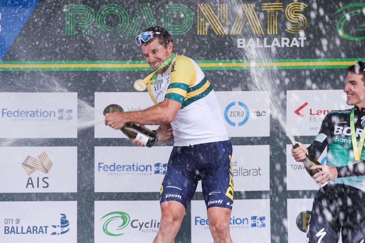 Brenton Jones sprays the champagne