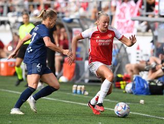 Frida Maanum of Arsenal takes on Julie Soyer of Paris FC during the Women's UEFA Champions League Group 3 Round Match 2 between Paris FC and Arsenal Women at Linkoping Arena on September 09, 2023 in Linkoping, Sweden.