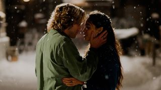 adam pascal and rosario dawson about to kiss each other in the snow in rent